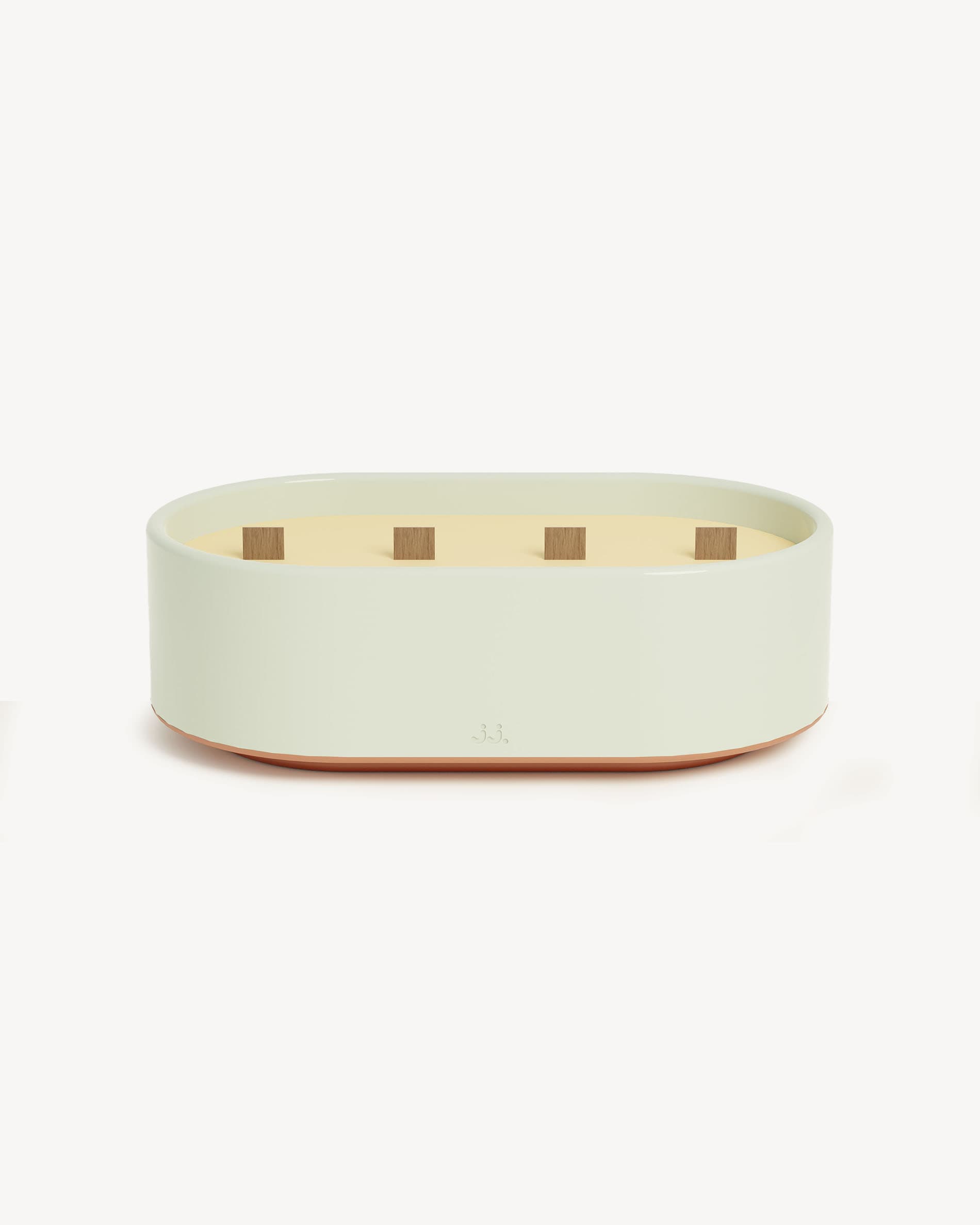 Bougie Totem L em cerâmica vidrada verde água, perfumada com citronela e notas de eucalipto.