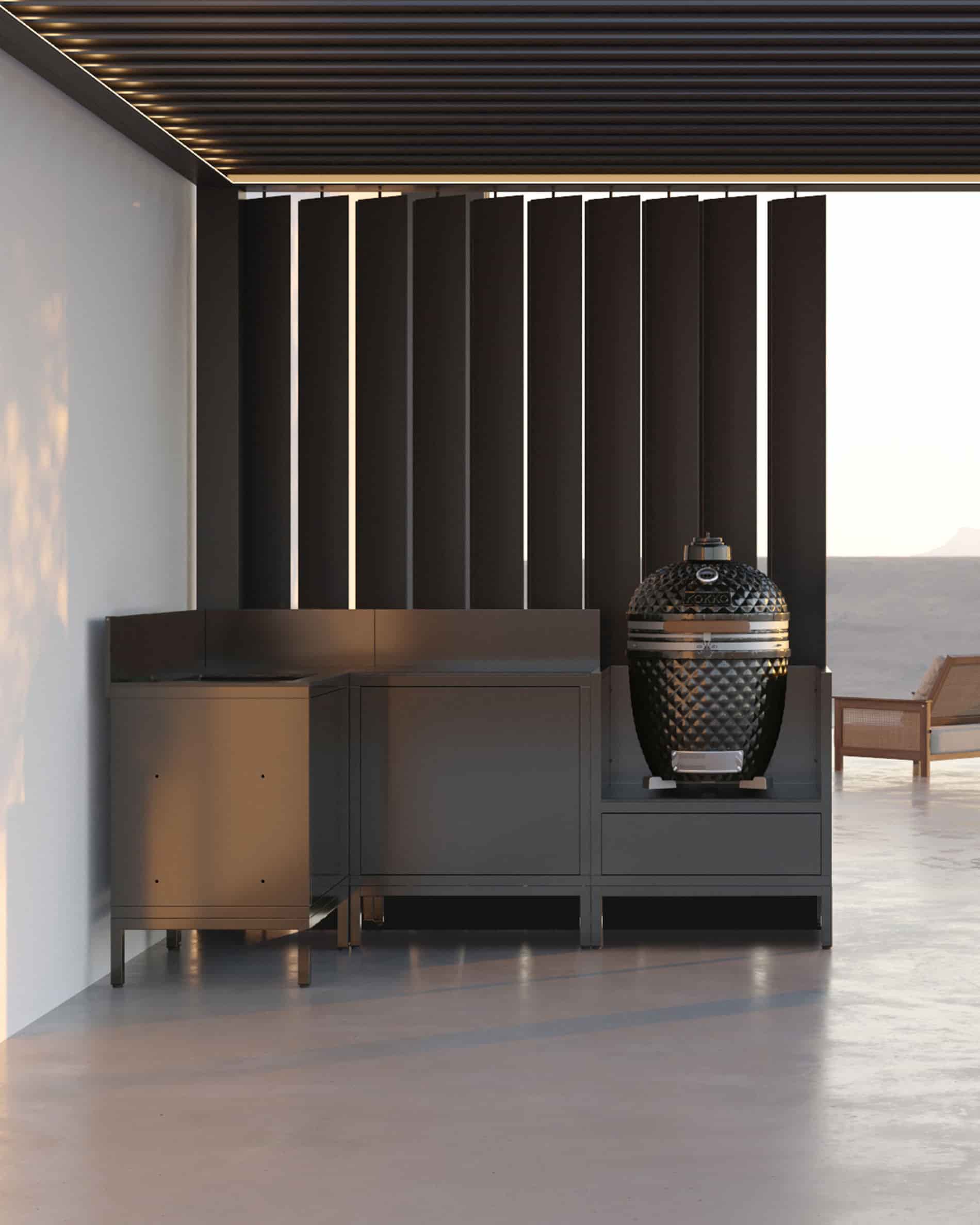 Cozinha de canto sobre pilotis com kamado, móveis fechados pretos e bancada sob pérgula.