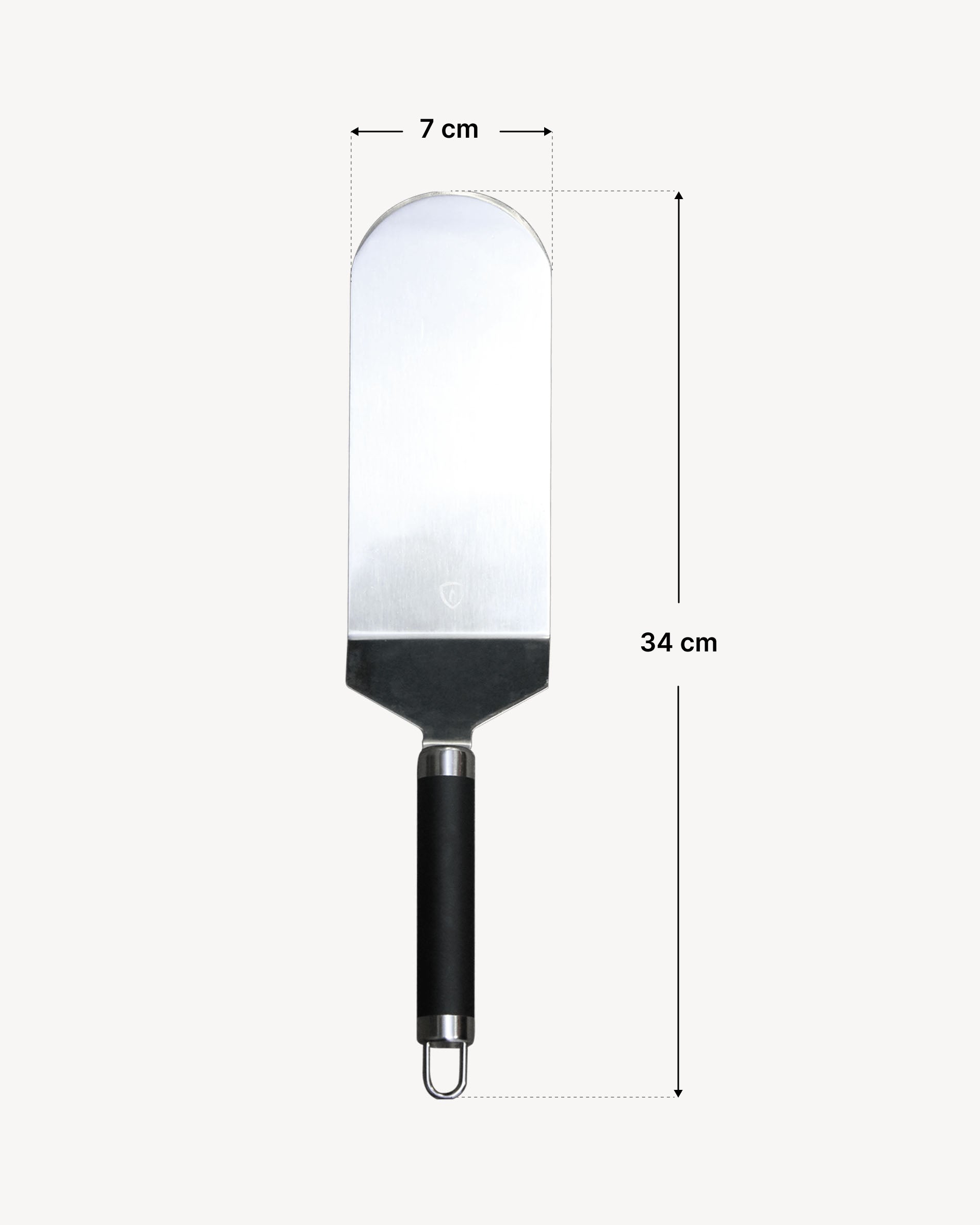 Espátula para peixe em inox com lâmina arredondada e cabo ergonómico preto, apresentada sobre fundo claro com indicação das dimensões: largura da lâmina de 7 cm e comprimento total de 34 cm.